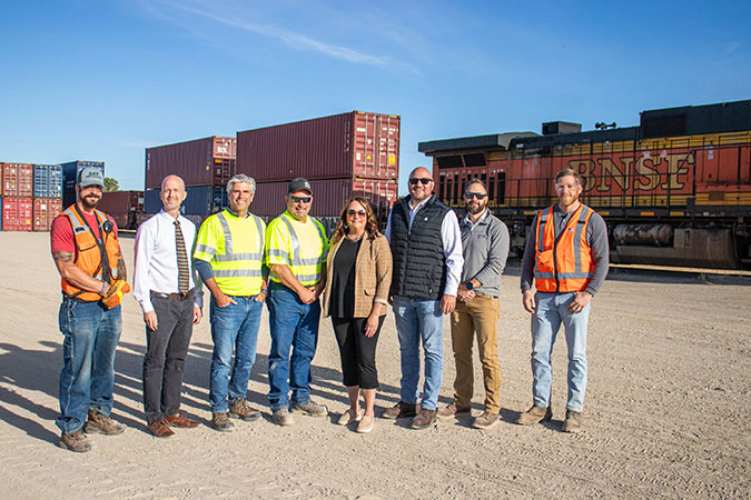 The 1,000th BNSF train that RMG loaded; from left to right: Conductor Michael Berman; Minot Area Chamber EDC Mark Lyman; RMG CEO Greg Oberting; RMG General Manager Chris Rehder; Minot Area Chamber EDC CEO Brekka Kramer; BNSF Supt. of Operations Dave McCann; BNSF Terminal Manager (Minot) Andrew Sprague; and BNSF Terminal Trainmaster (Minot) Sam Huff. The 1,000th BNSF train that RMG loaded; from left to right: Conductor Michael Berman; Minot Area Chamber EDC Mark Lyman; RMG CEO Greg Oberting; RMG General Manager Chris Rehder; Minot Area Chamber EDC CEO Brekka Kramer; BNSF Supt. of Operations Dave McCann; BNSF Terminal Manager (Minot) Andrew Sprague; and BNSF Terminal Trainmaster (Minot) Sam Huff.